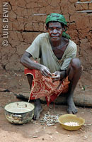 Bedzan Pygmy woman preparing food