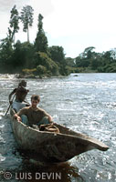 Luis Devin in a large pirogue on a river